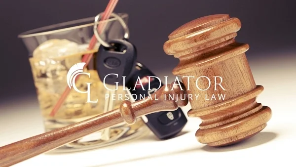 A glass of whiskey, car keys and a judges gavel, representing drunk driving injury claims